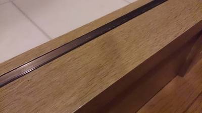 補修後の洗面所入口の敷居の仕上がりの写真